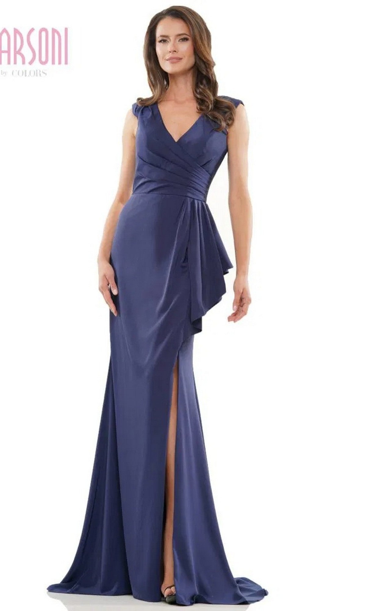A woman wears the Marsoni MV1227 long formal dress in navy—a sheath gown with a wrap-style ruched bodice, V-neckline, cap sleeves, and a high side slit.